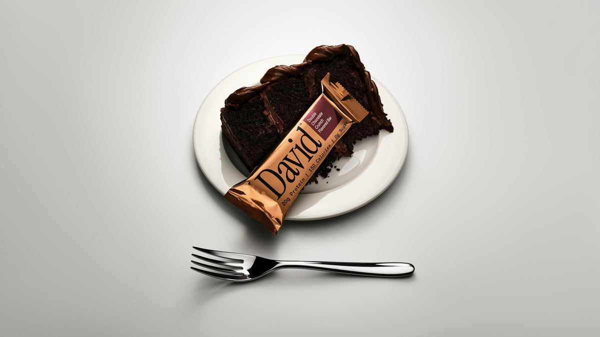 Double Chocolate Bronze bar on a plate with chocolate cake