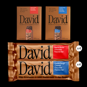 Two packages of David protein bars on a black background.