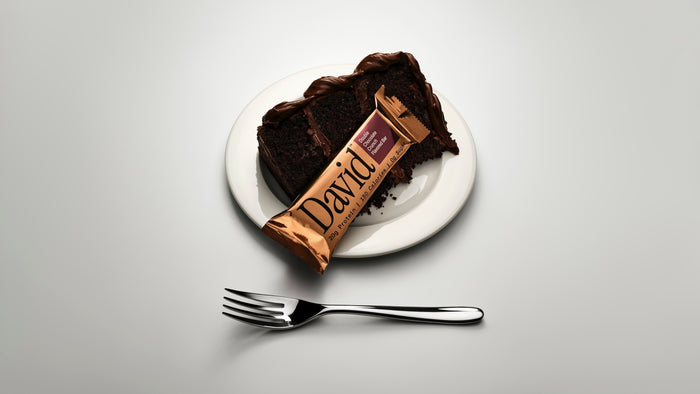 Double Chocolate Bronze bar on a plate with chocolate cake