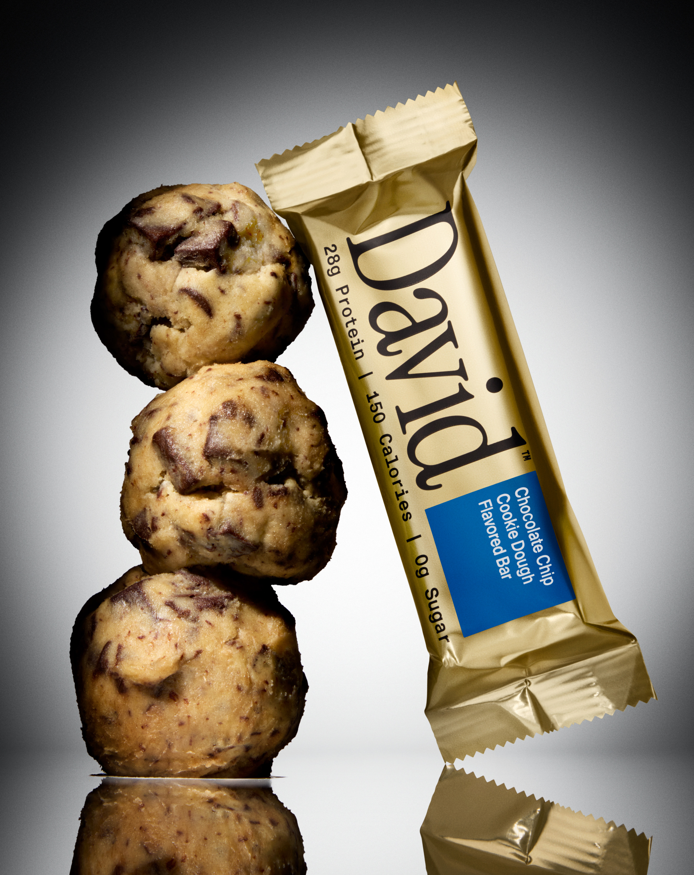 David Gold Chocolate Chip Cookie Dough protein bar with stacked cookie dough balls.
