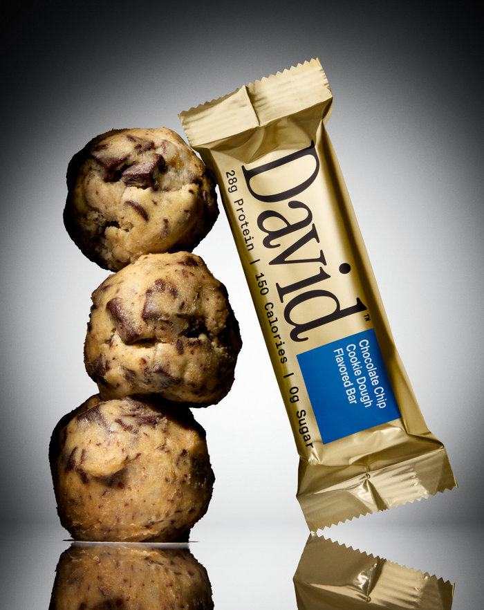 David Gold Chocolate Chip Cookie Dough protein bar with stacked cookie dough balls.
