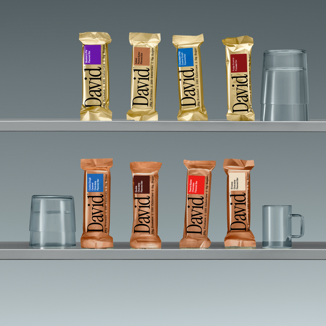 Shelf with David Protein bars and cups against a gray background.