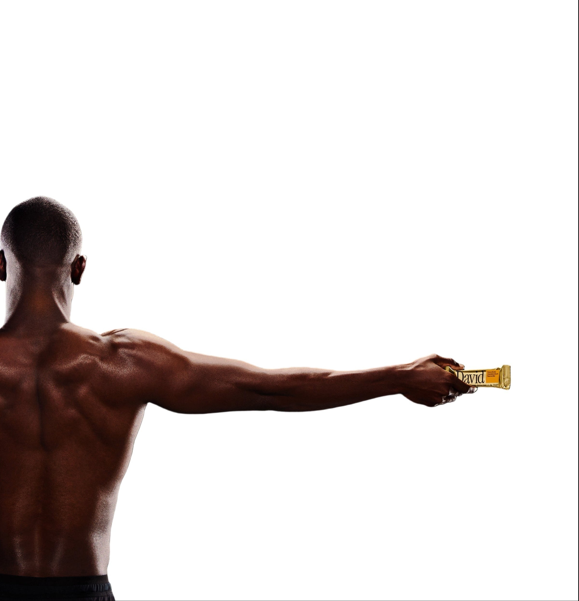 Muscular man holding a gold David Protein bar with a white background