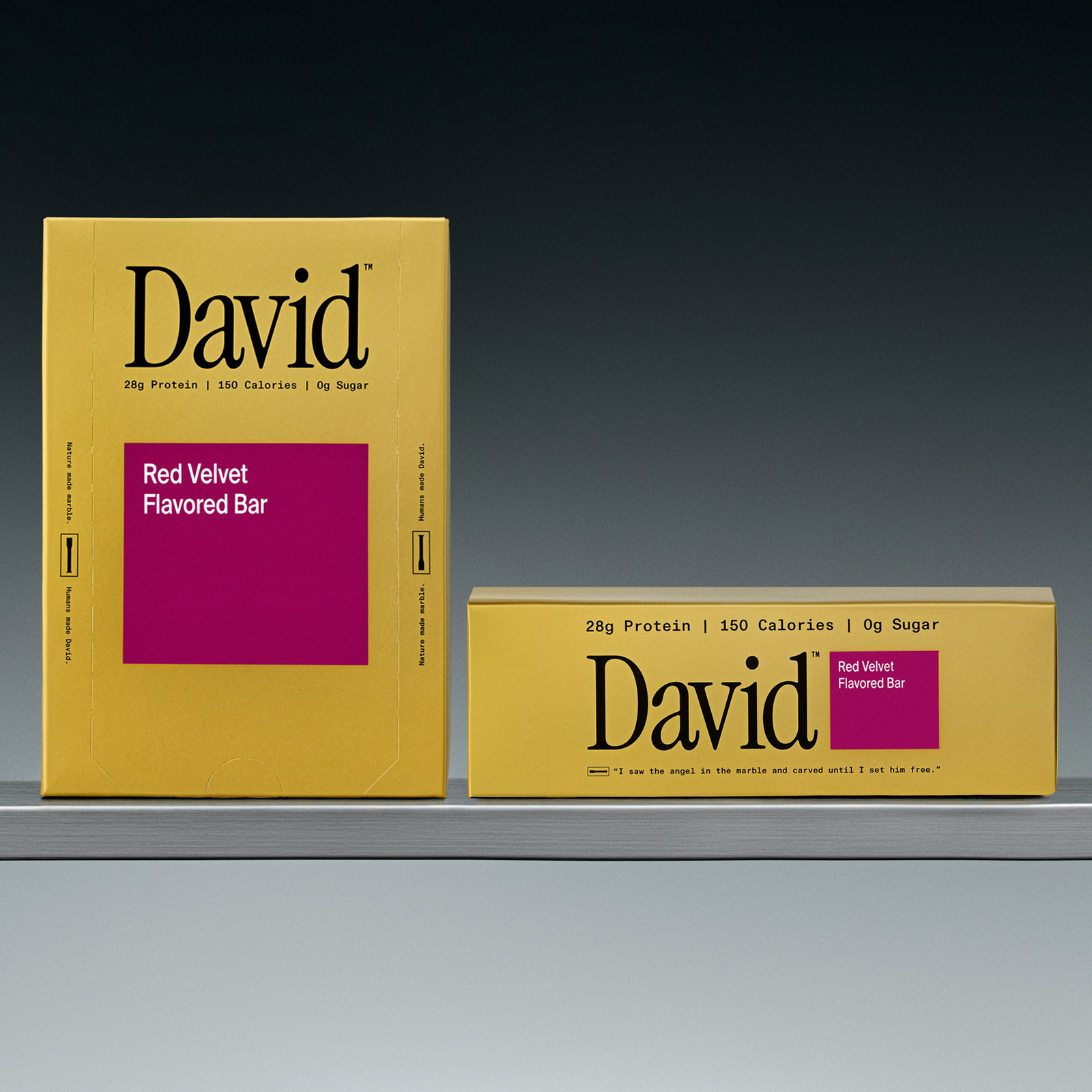 Two David Red Velvet flavored bars on a shelf with a gray background