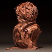 Chocolate ice cream scoops against a dark background